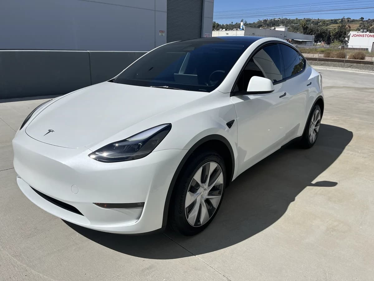 White Tesla Model Y after window tint installation by Finesse Auto Detail